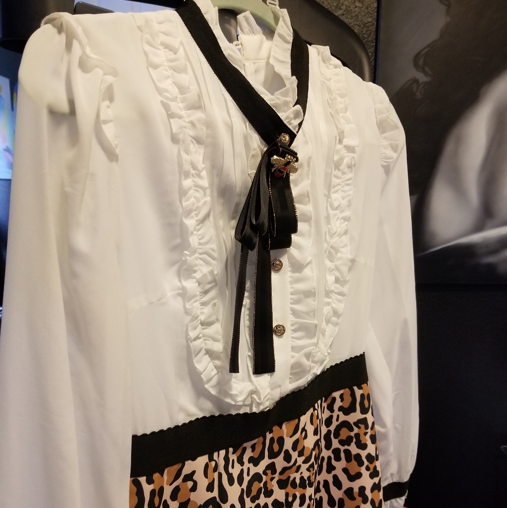 Brand new leopard print dress with tags boutique quality, size small fit 2/4